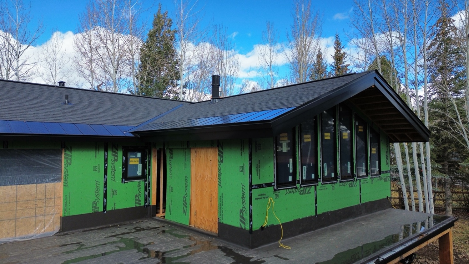 New black metal fascia and soffit trim during an exterior build